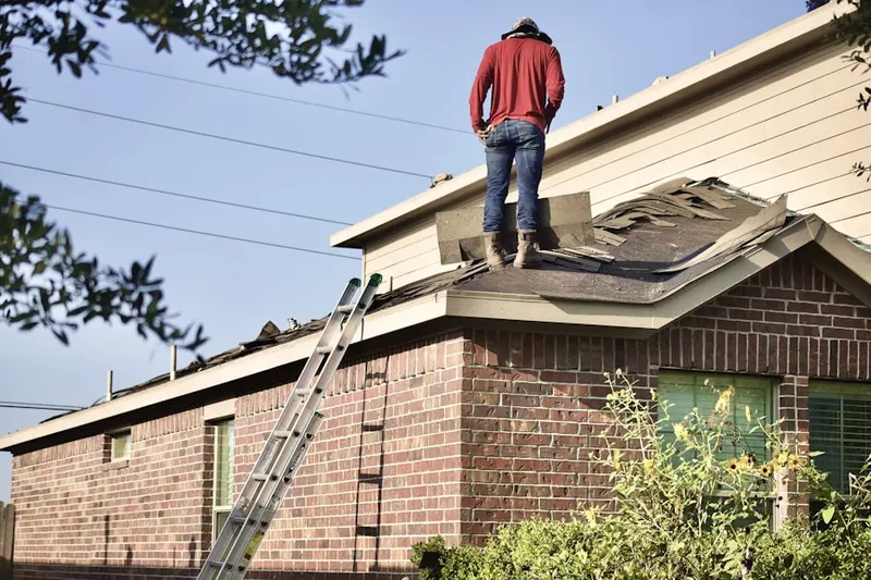 Professional roofer working on a residential roof in Traffic Circle
